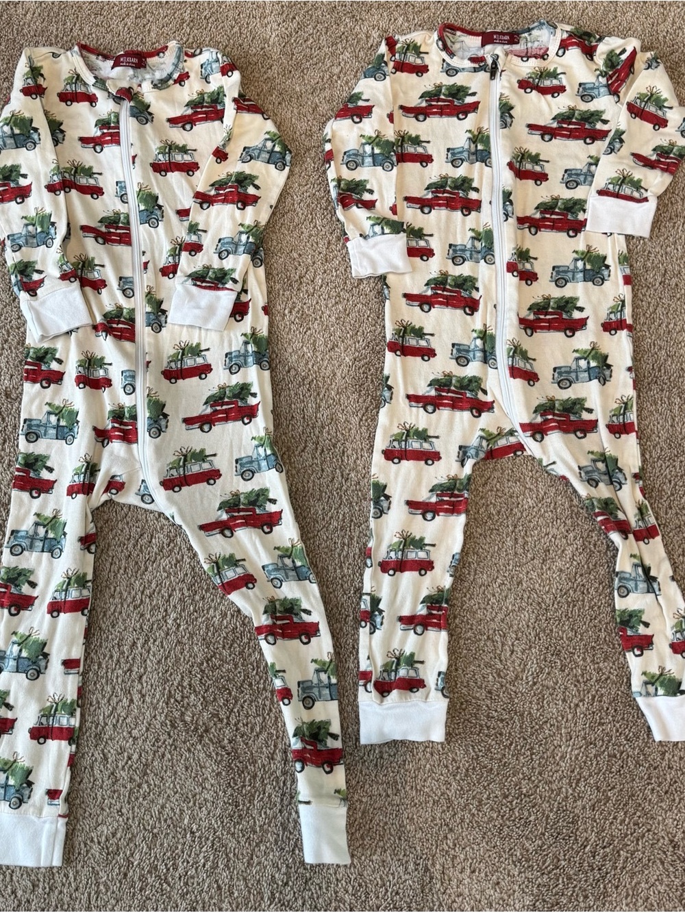 Milkbarn Cream Footed One-Piece with Red and Blue Holiday Truck Print